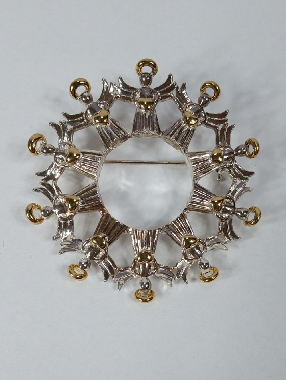 Vintage AvonTwo-Tone Gold and Silver Circle Of Angels Brooch